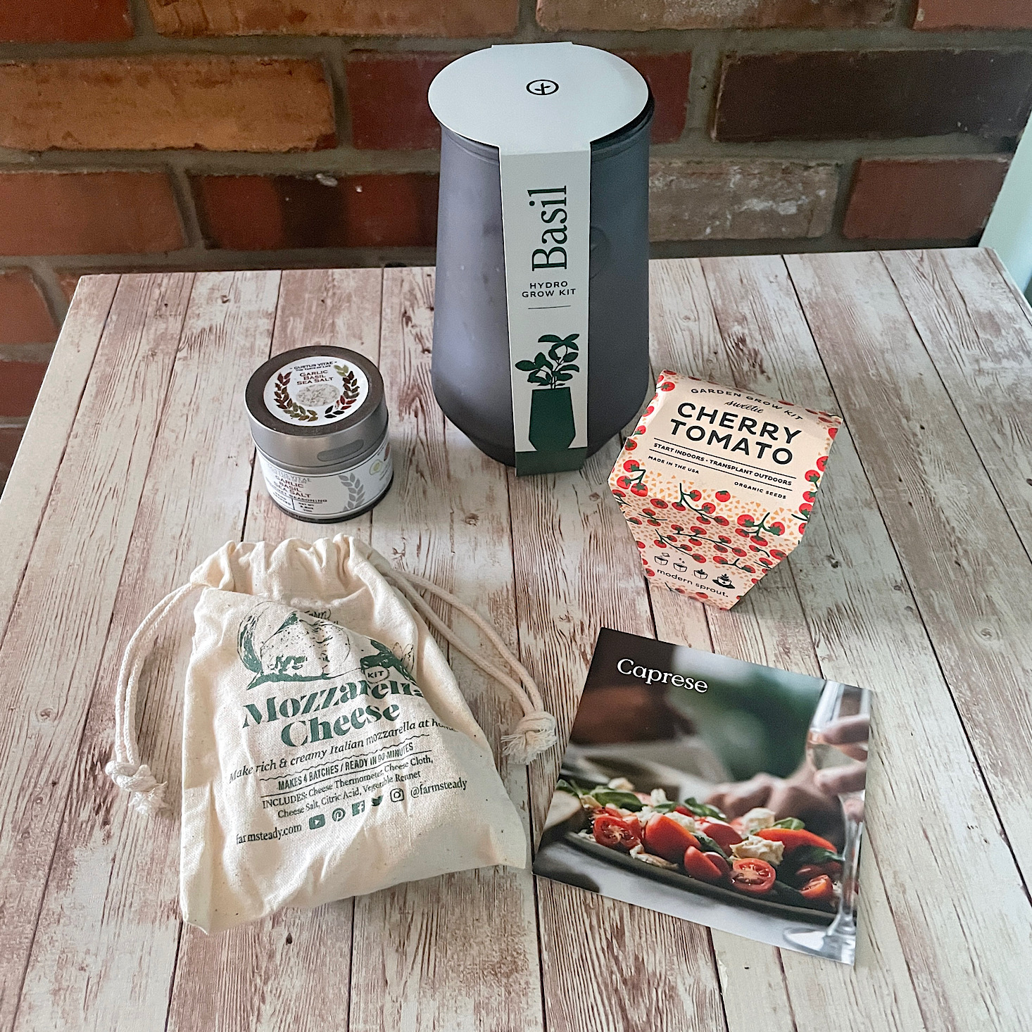 A mozzarella-making kit, cherry tomato and basil grow kits, and seasonings from Bespoke Post.