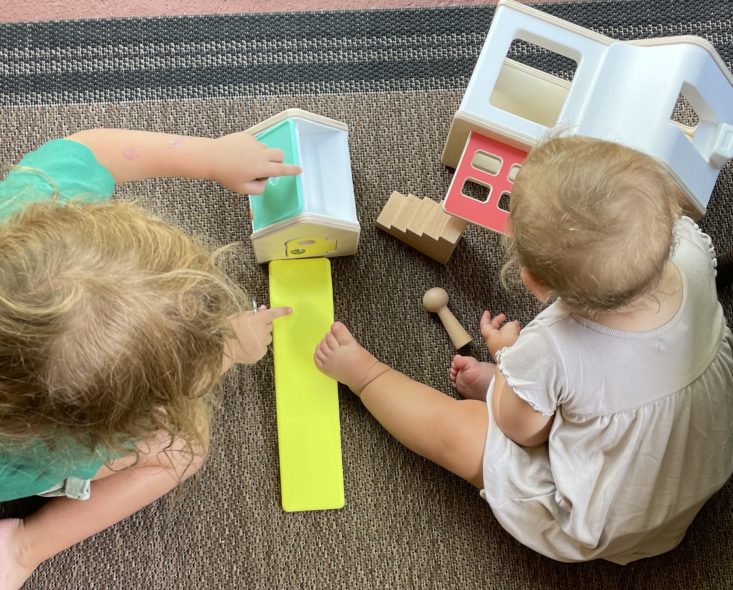 Christen's daughters playing with the Modular Playhouse from The Observer Play Kit by Lovevery.